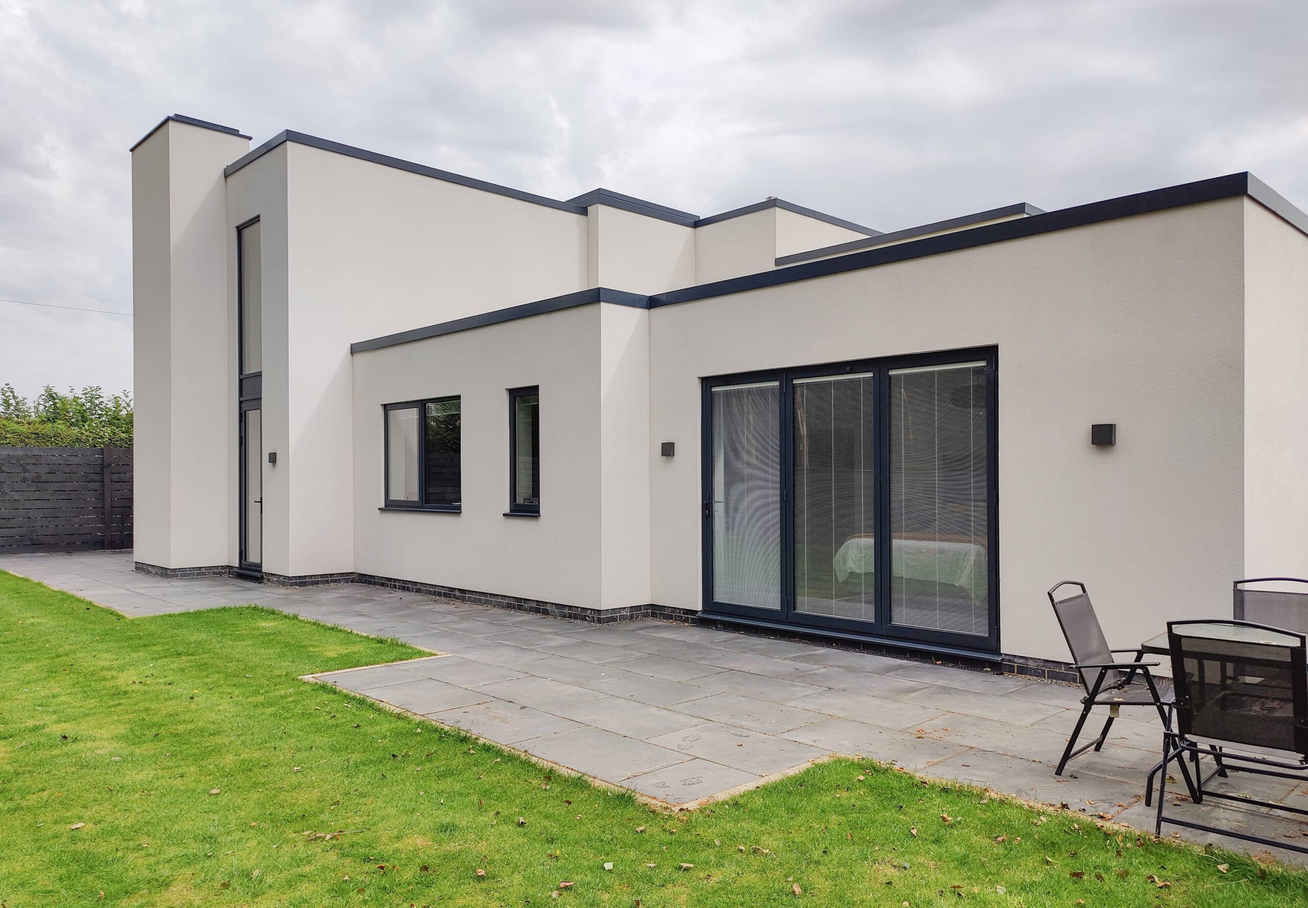 Simon Foote Architects Derby Residential modern Contemporary New Build flat roof white box render Kirk Langley Ashbourne Rear Garden House Large Chimney